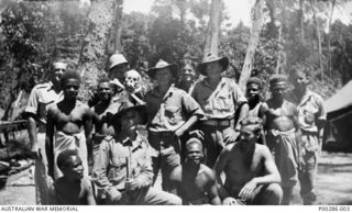 WEWAK SECTOR, NEW GUINEA, 1945-08-15. MEMBERS OF THE 'M' SPECIAL UNIT, ALLIED INTELLIGENCE BUREAU. LEFT TO RIGHT: BACK ROW: CAPTAIN H. AIKEN, AIF (EX COASTWATCHER); LIEUTENANT D.H. HARRISON, AIF ..