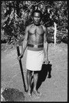 Man posing with old police belt and afui, also alafolo, club