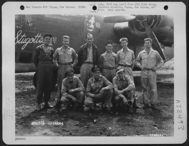 Captain Stevens And Crew Of The 65Th Bomb Squadron, 43Rd Bomb Group, Pose Beside The Consolidated B-24 'Stugotts 1St' At Dobdura Airstrip, Papua, New Guinea. 12 February 1944. (U.S. Air Force Number 72382AC)