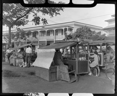 Fruit stall, Papeete, Tahiti, showing locals selling fruit