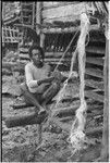 Mogiovyeka, smoking cigarette and making a fishing net