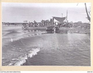 WEWAK AREA, NEW GUINEA. 1945-07-18. MEMBERS OF 2/1 INFANTRY BATTALION ARRIVING AT THE BEACH CAMP FROM YARABOS FOR A FEW DAYS WELL EARNED REST