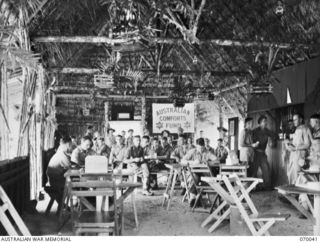 PORT MORESBY, NEW GUINEA. 1944-01-22. THE INTERIOR OF THE RECREATION HUT BUILT BY THE 2/101ST GENERAL TRANSPORT COMPANY IN THEIR CAMPING AREA. THE RECREATION HUT WAS EQUIPPED BY THE AUSTRALIAN ..