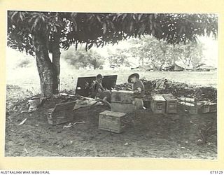 BULATAGI, NEW GUINEA. 1944-07-31. NO. 2 GUN OF D TROOP, 28TH FIELD BATTERY, FIRING AT THE TARGETS FROM A RANGE OF 9000 YARDS DURING A UNIT PRACTICE SHOOT WITH THEIR 25 POUNDERS. IDENTIFIED ..