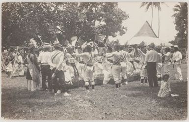 People performing holding union jack flags