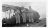 [Three nurses at plane wreckage in Saipan, 1944]