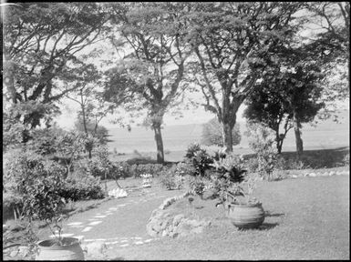 View past clamshells to harbour, Chinnery's garden, Malaguna Road, Rabaul, New Guinea, ca. 1936 / Sarah Chinnery