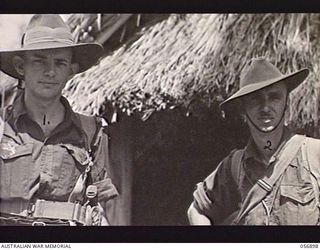 PORT MORESBY, NEW GUINEA. 1943-09-13. MEMBERS OF THE AUSTRALIAN MILITARY HISTORY SECTION ATTACHED TO HEADQUARTERS, NEW GUINEA FORCE. VX19509 LIEUTENANT W. SANDERS (LEFT) AND LANCE SERGEANT N. B. ..