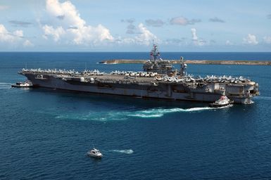 The US Navy (USN) Aircraft Carrier USS KITTTY HAWK (CV-63) departs Naval Forces Marianas Support Activity, Guam, after a four-day port visit. Currently under way in the 7th Fleet area of responsibility (AOR), the KITTY HAWK demonstrates power projection and sea control as the US Navy's only permanently forward-deployed aircraft carrier