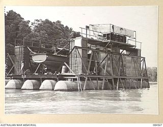 LAE AREA, NEW GUINEA. 1944-12-17. THE 12 SMALL SHIP COMPANY CRAFT AM 10 DOCKED FOR REPAIR AT HERZOG LAGOON. THIS IS THE FIRST VESSEL TO MAKE USE OF THIS DOCK