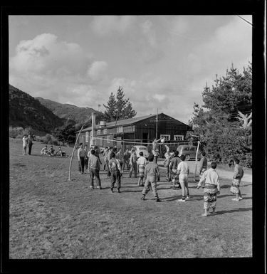 Unidentified Pacific Island boys playing volleyball at Reikorangi camp, Kapiti Coast District