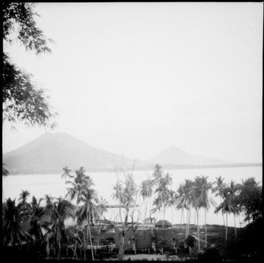Water tanks and a thatched building, Rabaul Harbour, New Guinea, 1937 / Sarah Chinnery