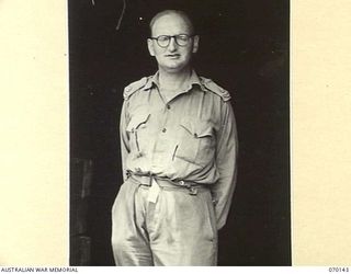 RAMU VALLEY, NEW GUINEA. 1944-02-04. VX80901 MAJOR C.S. MCKAY (1) OF THE STAFF OF ASSISTANT DIRECTOR ORDNANCE SERVICE, 7TH DIVISION