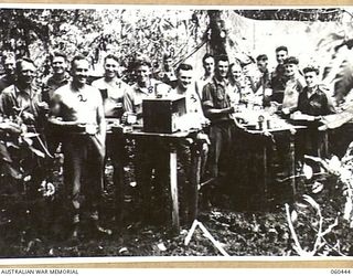 FINSCHHAFEN AREA, NEW GUINEA. 1943-11-07. GUNNER MESS, HEADQUARTERS, ROYAL AUSTRALIAN ARTILLERY, 9TH AUSTRALIAN DIVISION AT LANGEMAK BAY. SHOWN ARE: WX6034 GUNNER J. M. HARRIES (1); VX73221 GUNNER ..