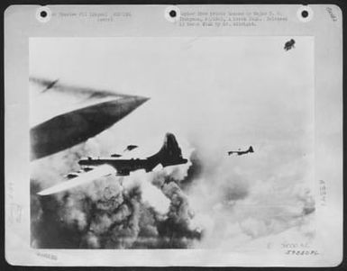 B-29's Of The 497Th Bomb Group, 73Rd Bomb Wing, Based On Saipan Rush Into Smoke Cumulus Over A Jap Target. (U.S. Air Force Number 59550AC)