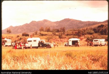 Open vehicles and people gathered