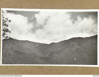 WAU, NEW GUINEA. 1944-02-11. MOUNTAIN VIEW FROM A HIGH POINT ON THE NEW WAU ROAD WHICH IS BEING BUILT BY ENGINEERS OF THE 2/4TH FIELD SQUADRON, ROYAL AUSTRALIAN ENGINEERS