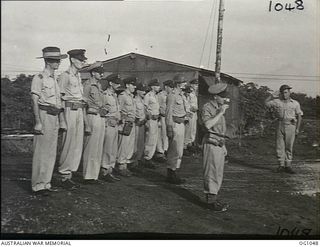 KIRIWINA, TROBRIAND ISLANDS, PAPUA. C. 1944-03. AIRCREW AND ADMINISTRATION OFFICERS OF NO. 30 (BEAUFIGHTER) SQUADRON RAAF TAKE SALUTE ON COMMANDING OFFICER'S PARADE