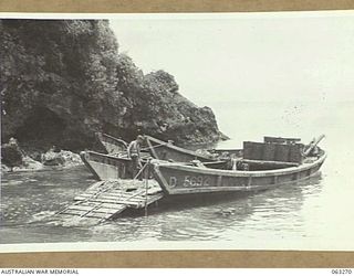 WALINGAI BEACH, NEW GUINEA. 1944-01-02. JAPANESE BARGES WHICH WERE SUNK BY AMERICAN P.T. BOATS DURING THE ACTION IN THE AREA