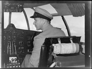 Captain in cockpit of aircraft during Tasman Empire Airways air boat RMA New Zealand ZK-AME flight to Fiji