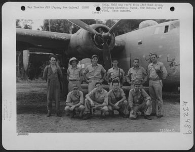 Captain Ostander and crew of the 64th Bomb Squadron, 43rd Bomb Group, pose by their Consolidated B-24 "Liberator" at Dobodura Airstrip, Papua, New Guinea. (U.S. Air Force Number 72378AC)