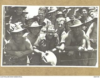 TOWNSVILLE, QUEENSLAND, AUSTRALIA. 1944-01-28. PERSONNEL OF THE 24TH INFANTRY BRIGADE ABOARD THE TROOPSHIP "VAN HEUTSZ" IMPATIENTLY WAITING TO LAND IN AUSTRALIA AFTER A LONG TOUR OF DUTY IN NEW ..