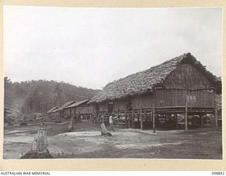 PIEDU ISLAND, SOLOMON ISLANDS. 1945-11-13. THE LINE OF LIVING HUTS USED BY JAPANESE IN AREA 12. JAPANESE CONCENTRATED ON THE ISLAND ARE UNDER THE CONTROL OF 7 INFANTRY BATTALION