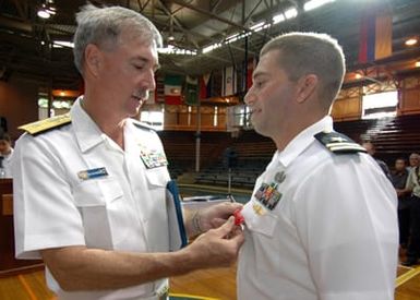 U.S. Navy Rear Adm. T. G. Alexander (left), Commander, Navy Region Hawaii, presents the Bronze Star on behalf of the President of the United States to LT. Brian Skubin, assigned to Explosive Ordnance Disposal Mobile Unit 3, Detachment Middle Pacific, during an awards ceremony on board Naval Station Pearl Harbor, Hawaii, on Oct. 19, 2006. The Bronze Star is the fourth-highest military decoration and is awarded for bravery, heroism or meritorious service. (U.S. Navy PHOTO by Mass Communication SPECIALIST 1ST Class James E. Foehl) (Released)