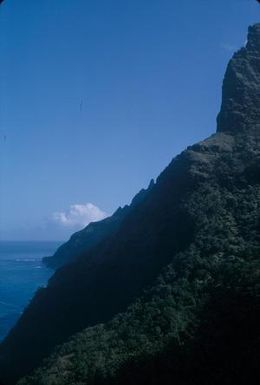 [Rocky coastline view with cloud of Kauai Island, United States]