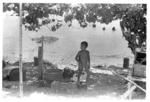 Child standing in yard