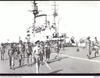 WEWAK HARBOUR, NEW GUINEA, 1945-12-13. MEMBERS OF 6 DIVISION EXPLORING THE FLIGHT DECK OF THE AIRCRAFT CARRIER HMS IMPLACABLE. APPROXIMATELY 2,200 MEMBERS OF 6 DIVISION EMBARKED ON THE CARRIER FOR ..