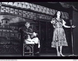 RABAUL, NEW BRITAIN, 1946-02-05. STAFF SERGEANT E.L. STRACHAN, AUSTRALIAN WOMEN'S ARMY SERVICE, (TERESA) SINGING HER SOLO DURING THE PERFORMANCE OF THE MUSICAL COMEDY "THE MAID OF THE MOUNTAINS" BY ..