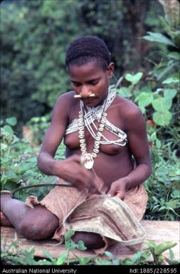 Girl weaving bilum