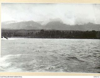 KARKAR ISLAND, NEW GUINEA. 1944-09-20. THE VIEW OF THE DOGAWAN PLANTATION FROM A BARGE LEAVING THE ISLAND. NATIVES WORKING UNDER THE DIRECTION OF THE AUSTRALIAN NEW GUINEA ADMINISTRATIVE UNIT ARE ..