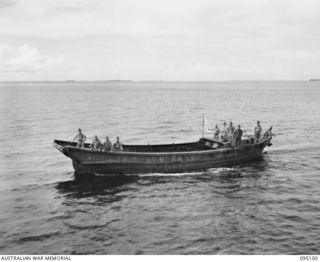 AT SEA, OFF BUIN, BOUGAINVILLE, 1945-08-20. A JAPANESE BARGE CARRYING THE FLAG OF TRUCE LAYING OFF THE CORVETTE HMAS LITHGOW AWAITING A REPLY TO SURRENDER NEGOTIATIONS BEING CARRIED OUT BY WIRELESS ..