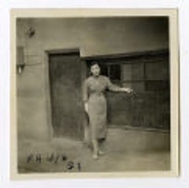 Woman standing in front of building