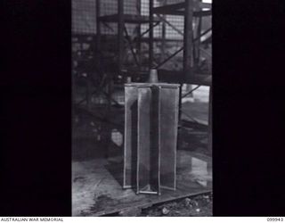 RABAUL, NEW BRITAIN, 1946-03-29. A SPECIALLY DESIGNED WATER FILTER AT THE AUSTRALIAN ARMY CANTEENS SERVICE CORDIAL FACTORY. THE FACTORY, STAFFED BY SEVEN SKILLED ARMY PERSONNEL, A CHINESE AND ..