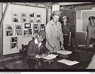 TOROKINA, BOUGAINVILLE. 1945-09-08. LIEUTENANT-GENERAL (LT-GEN) S. G. SAVIGE, GENERAL OFFICER COMMANDING 2 CORPS, ACCEPTED THE SURRENDER OF ALL JAPANESE FORCES ON BOUGAINVILLE FROM LT-GEN M. KANDA, ..