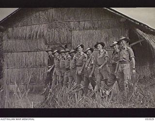 SOGERI VALLEY, NEW GUINEA, 1943-06-26. OFFICERS ON THE STAFF OF THE NEW GUINEA FORCE SCHOOL OF SIGNALS. LEFT TO RIGHT: NX58453 CAPTAIN (CAPT) T. W. C. SAYWELL (SECOND IN CHARGE); VX108275 ..