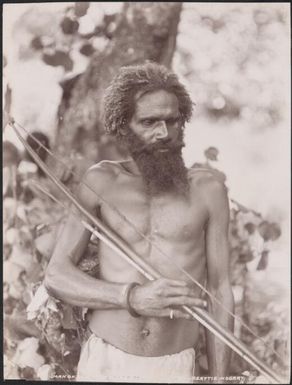 A man of Opa holding a bow and arrow, New Hebrides, 1906 / J.W. Beattie