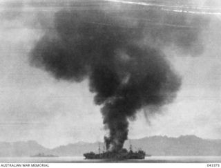 GUADALCANAL AREA, 1942-08. UNITED STATES TRANSPORT, USS GREG ELLIOTT, IN FLAMES AFTER BEING HIT BY JAPANESE AIRCRAFT