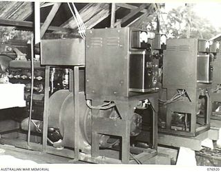 LAE, NEW GUINEA. 1944-11-15. A SECTION OF THE ELECTRICITY GENERATING PLANT OF THE 2/7TH ADVANCED WORKSHOPS, WHICH CONSISTS OF 3 X 35KW "BUDDA" GENERATING SETS