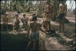 Mata'i Taria archaeological excavation, Moorea: children watching excavators at work