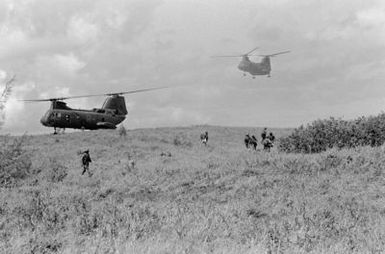 A CH-46 Sea Knight helicopter from Marine Medium Helicopter Squadron 262 (HMM-262) lands to drop off Marines from Company E, 2nd Bn., 3rd Marines, Marine Corps Air Station, Kaneohe Bay, during a combat readiness evaluation exercise