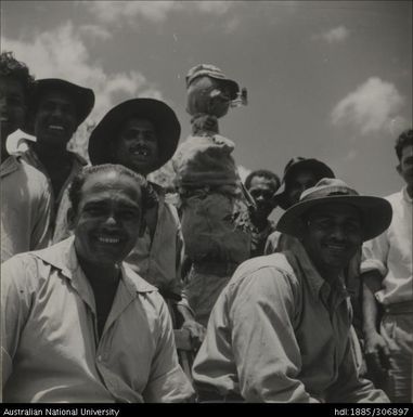 Farmers with scarecrow