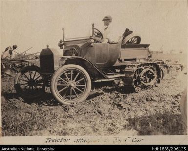 Tractor attached to a Ford car