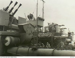 AT SEA, NEW GUINEA. 1944-06-19. SIDE BY SIDE IN HARBOUR WHILE REFUELLING ARE THESE TWO AUSTRALIAN WARSHIPS, H.M.A.S. "ARUNTA" AND H.M.A.S. "WARRAMUNGA"
