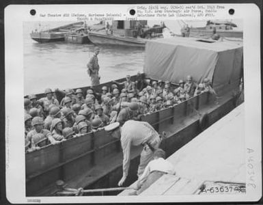 7Th Bomber Command Personnel Land At Tanapag Harbor, Saipan, Marianas Islands. 4 August 1944. (U.S. Air Force Number A63637AC)