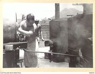 RABAUL, NEW BRITAIN, 1945-10-17. A DRIP FEED OF DISTILLATE AND WATER WHICH IS USED FOR THE LARGE BAKING FURNACES OPERATED BY SECTION 2, 8 FIELD BAKING PLATOON, HEADQUARTERS 11 DIVISION AREA