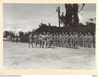 BOUGAINVILLE, 1945-06-13. THE GOVERNOR GENERAL OF NEW ZEALAND, MARSHAL OF THE ROYAL AIR FORCE, SIR CYRIL L.N. NEWALL (1), INSPECTING THE AMERICAN GUARD OF HONOUR, THE UNITED STATES MARINE CORPS, AT ..